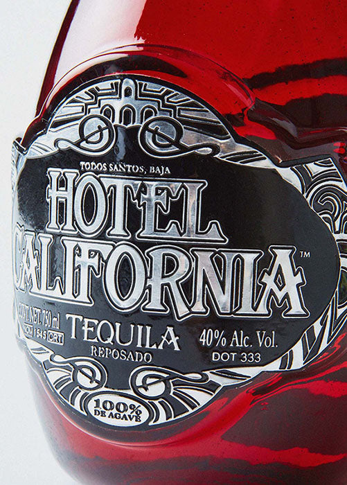 Bottle of Hotel California Reposado Tequila. A premium, craft tequila honoring generations of tequila making tradition, the land from which it comes and the community of artists and craftsman that make it. 100 percent Blue Weber Agave. Jalisco, Mexico 